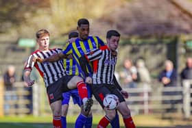 Scott Wilson, left, and Adam Blakeman, right, battle for the ball against King's Lynn (photo: David Airey/dia_images)