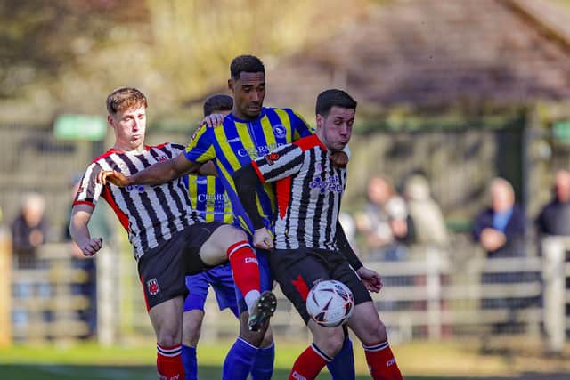 Scott Wilson, left, and Adam Blakeman, right, battle for the ball against King's Lynn (photo: David Airey/dia_images)
