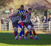 Scott Wilson, left, and Adam Blakeman, right, battle for the ball against King's Lynn (photo: David Airey/dia_images)