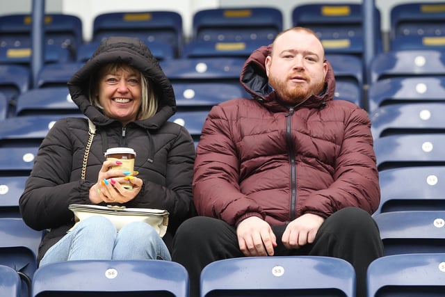 Two PNE fans before the game against QPR, one of them enjoying a welcome brew