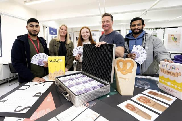 UCLan students recieving bursaries from Forepoint's Keith Noble and Abi Stones