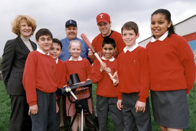 Debbie Stott, BAE Systems community relations advisor, Don Cunningham, general manager of Baseball Lancashire, and Jim Jolly, baseball Instructor, with pupils from Ribbleton Methodist Primary School.