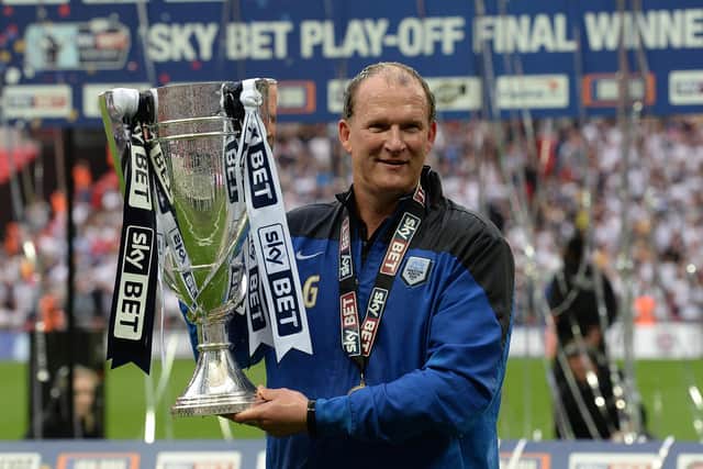 Simon Grayson celebrates winning the League One play-off final with Preston North End in May 2015
