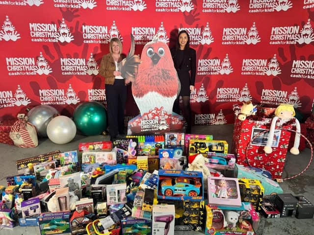 Lynne Duxbury (left) and Grace Yarlett (right) drop the gifts at Mission Christmas
