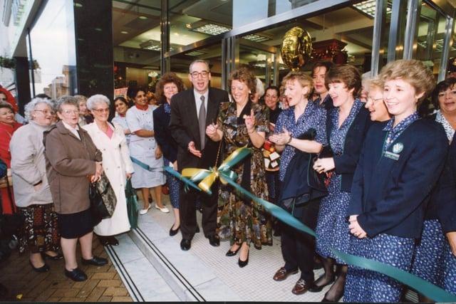 Customer Irene Preston prepares to cut the ribbon to reopen Marks & Spencer following a massive revamp in 1994