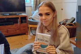 Grace pictured with her book 'An Unconventional Mind'