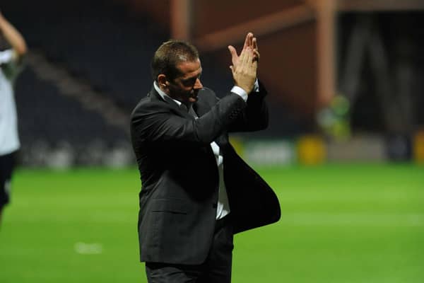Graham Westley applauds the North End fans.