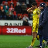 Preston North End's Ched Evans leaves the field injured against Rotherham United, the injury that has ruled him out for the season