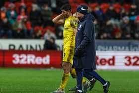 Preston North End's Ched Evans leaves the field injured against Rotherham United, the injury that has ruled him out for the season