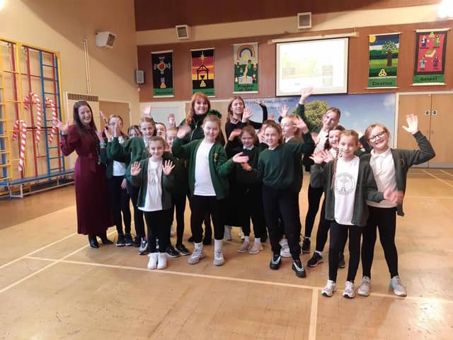The Duchess of York Sarah Ferguson with Jolie Forrest (15) and the dance students she coaches at Padiham Green Primary School