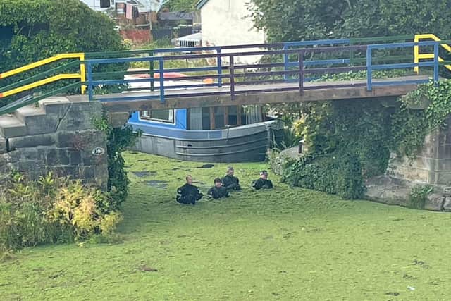 Police officers wade through Lancaster Canal in Preston on Wednesday (July 20) as they search for missing man Daniel Binkowski. Pic credit: Gary Read