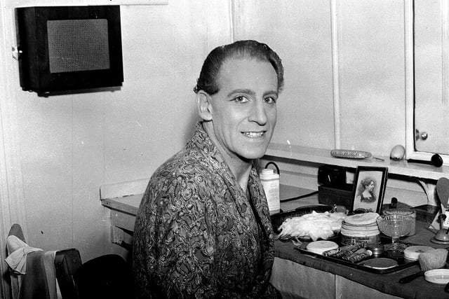 Film and stage actor Max Adrian in his dressing room at the Empire Theatre in May 1955.