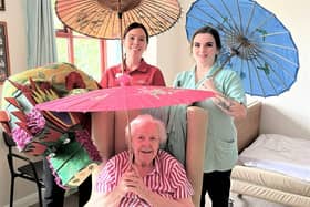 Resident Evelyn with team members Cara and Emily