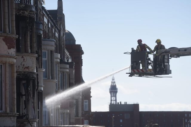 Firefighters continue damping down remaining hotspots at New Hacketts Hotel. Photo: Dan Martino