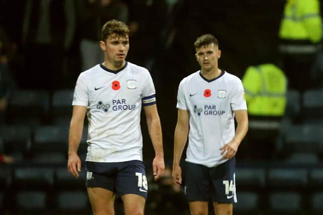 Ryan Ledson and Jordan Storey react after Millwall's Charlie Cresswell scored his side's fourth goal