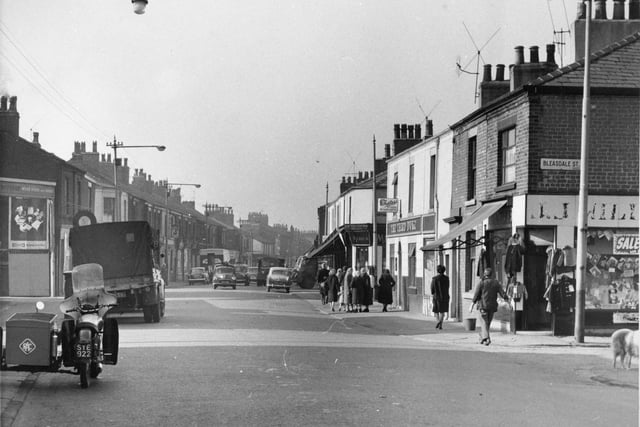 A shot of Ribbleton Lane looking towards Ribbleton Avenue - taken all the way back in 1964. Notice the gaggle of women doing their shopping and stopping for a gossip towards the middle of the picture. And the old motorbike complete with sidecar on the left