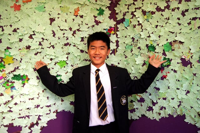 Ashton High School pupil Deming Lye with a Belief Tree on display at the school in Preston in 1997