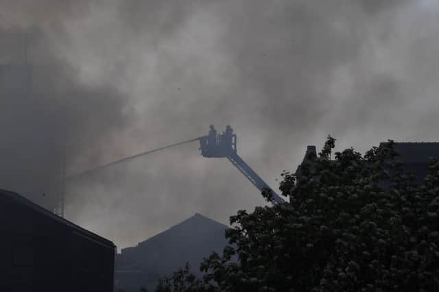 The latest scenes are firefighters battle the blaze.