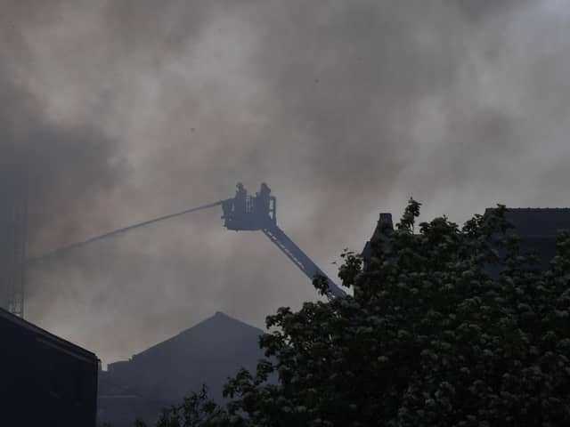 The latest scenes are firefighters battle the blaze.