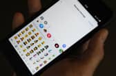 Apple could bring AI generated emojis to iPhones! (Picture: Tengku Bahar/AFP via Getty Images)