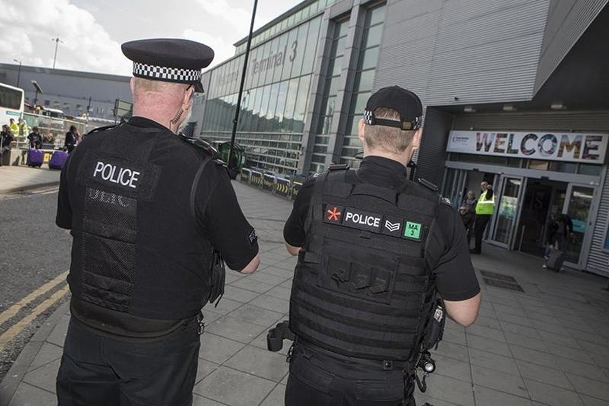 Police capture wanted man at Manchester Airport minutes before suspect jets off on holiday to Greece