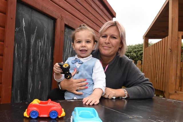 Sarah Kirkland, right, in the outdoor play area. 
Busy Bees at Bamber Bridge is officially open, the childcare facility has been refurbished after a fire last summer.