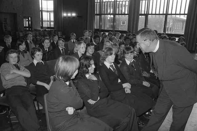 A hand of friendship was extended thousands of miles when a bishop from strife-town South Africa visited a Lancashire school. The Rt Rev Frederick Amoore, Bishop of Bloemfontein, called at the William Temple School, Preston, as part of a busy tour of the county