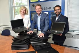 MHA Moore and Smalley has donated laptops to help those in need with computer refurb firm Nybble. Pictured Karen Morris, Graham Gordon, Ram Gupta