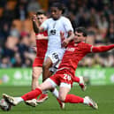 Callum Jones tackles Port Vale's Rhys Walters Picture: Gareth Copley/Getty Images