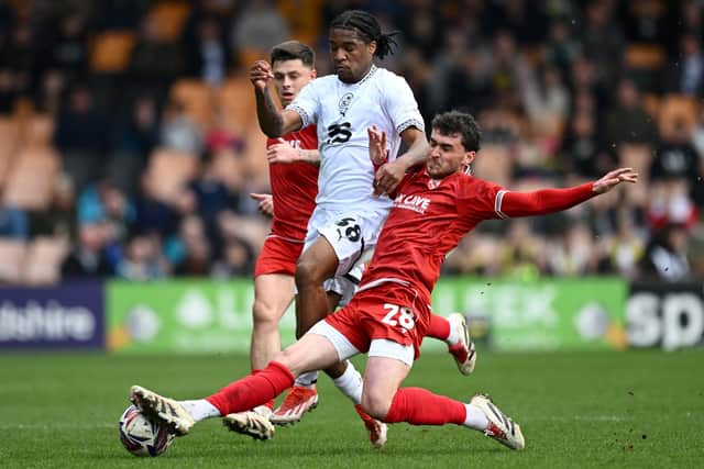 Callum Jones tackles Port Vale's Rhys Walters Picture: Gareth Copley/Getty Images