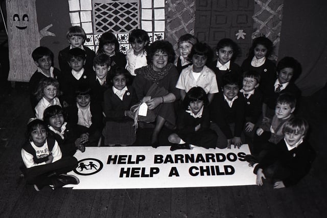 The children of Christ Church CE Primary School in Fitzroy Street, Preston, held a sponsored colouring session to raise money for the Barnardo's Help A Child Appeal. They raised £40, which they wrapped up as gift to present to Barnardo's representative Coun Vernonica Afrin (above with the children)