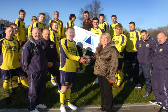 Players from Lostock Hall FC have raised £1,100 for St Catherine's Hospice by doing a three peaks challenge in 24 hours. They are pictured after presenting the cheque to Hospice head of fund raising Barbara Conroy