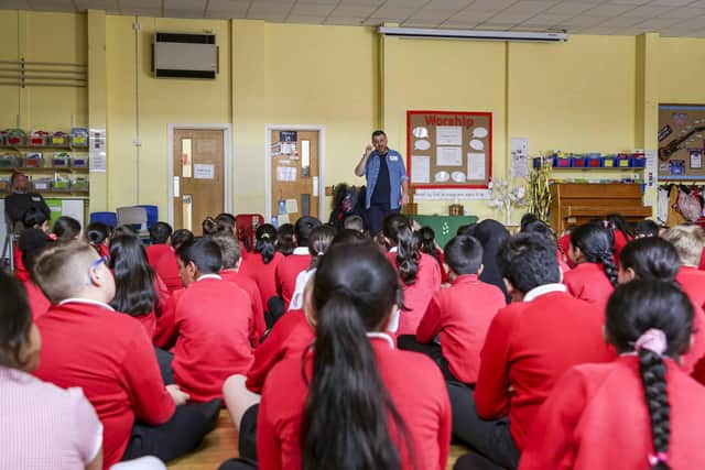 A storytelling session led by author John Hughes in a Young Reader’s Programme event at the Preston St Matthews Church of England Primary School