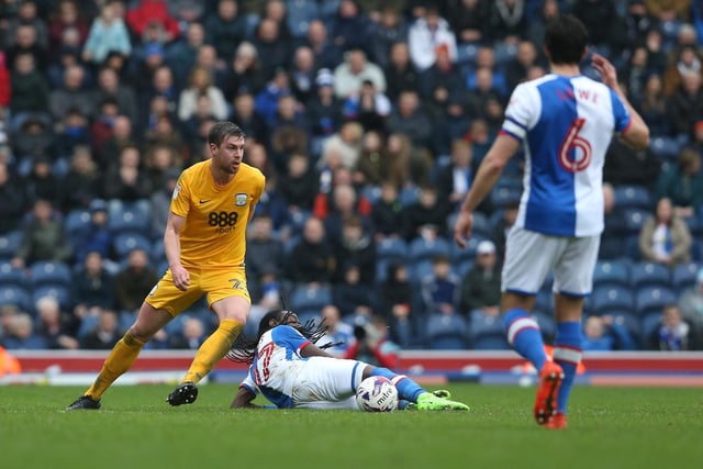 Preston North End's Paul Huntington comes out on top against Blackburn Rovers' Marvin Emnes