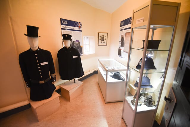 An exhibit of old police uniforms in the new museum.