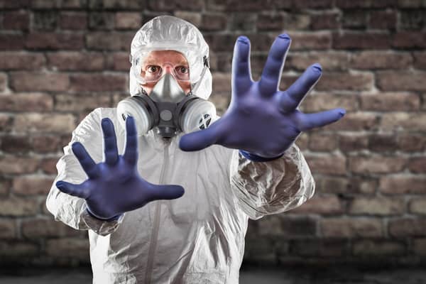It was like back in the Covid days, suiting up to clear out the loft. Photo: Adobe