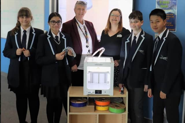 Year 8 pupils with their new 3D printer, supervised by the academy's head of computing Kim Webster and Create's education product manager Sonya Horton.
