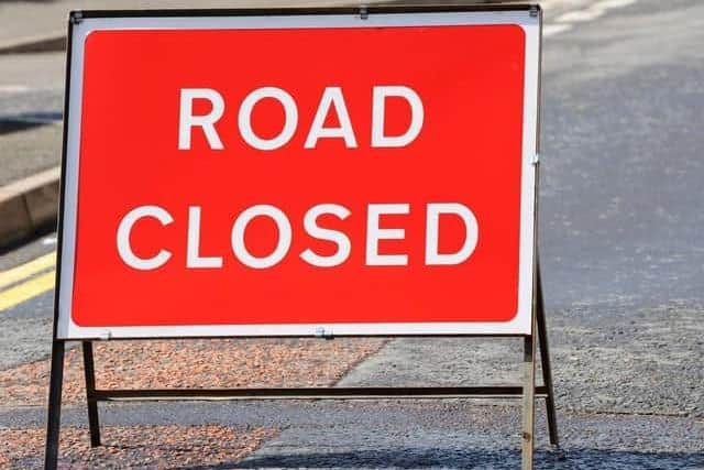 A crash involving a car and a tanker lorry closed a busy A-road in both directions near Accrington
