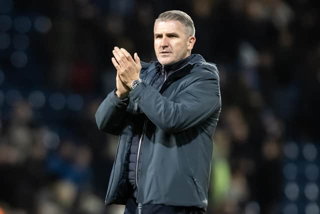 Preston North End's manager Ryan Lowe applauds his side's travelling supporters at the end of the match