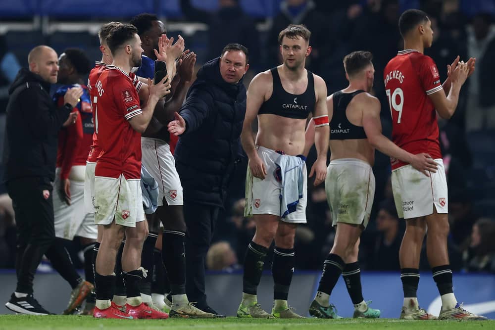 Morecambe manager Derek Adams, his players and staff switch attention back to the league after Saturday's FA Cup loss at Chelsea Picture: Bryn Lennon/Getty Images