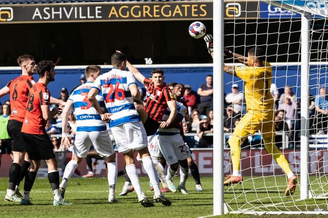 Preston North End's Jordan Storey looks on as Queens Park Rangers' goalkeeper Seny Dieng saves his goal bound header