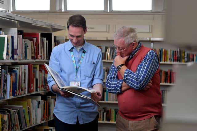 Photo Neil Cross; Michael Barret, left, has set up a mens mental health group :  'Mens Club' at Chorley library, pictured with Carl Burton