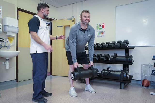 Physiotherapist Daniel Carroll and patient Matt Parry