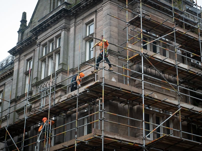 Workmen erecting scaffolding on the former Post Office building in Preston City Centre
