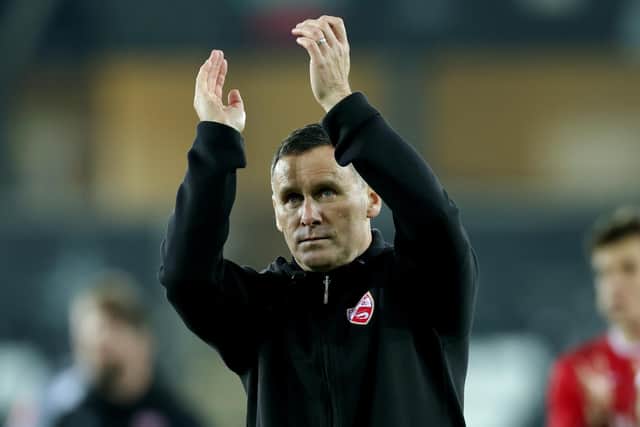 Morecambe boss Ged Brannan applauds those Shrimps fans who made the journey to Swansea City Picture: Eddie Keogh/Getty Images