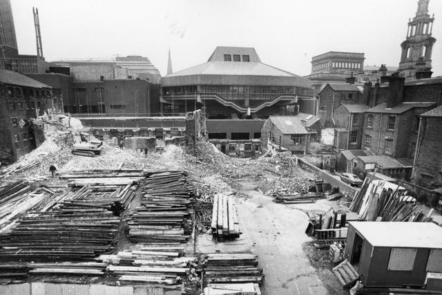 This image, captured in 1983, shows demolition of the old flax and cotton mill on Lord Street, Preston - standing in the shadow of the Guild Hall complex. To this day the area remains undeveloped