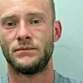 Karl Atkinson was given a three-year sentence in his absence after being convicted of burglary (Credit: Lancashire Police)