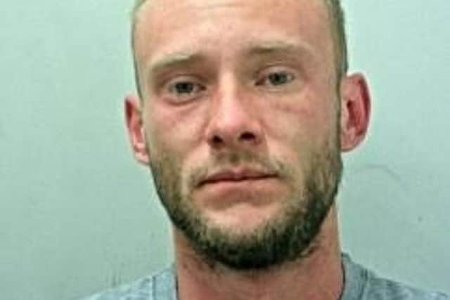 Karl Atkinson was given a three-year sentence in his absence after being convicted of burglary (Credit: Lancashire Police)