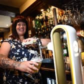 Nicola Denham behind the bar at The Grapes Inn, Goosnargh, Preston
