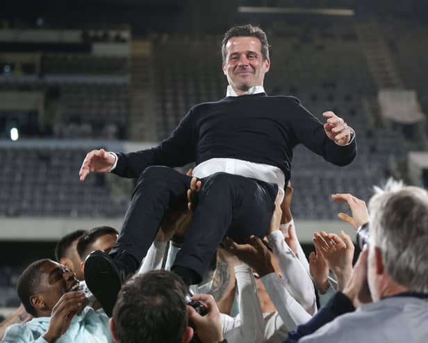 Fulham manager Marco Silva is lifted up by his players as promotion is celebrated after the win against Preston North End